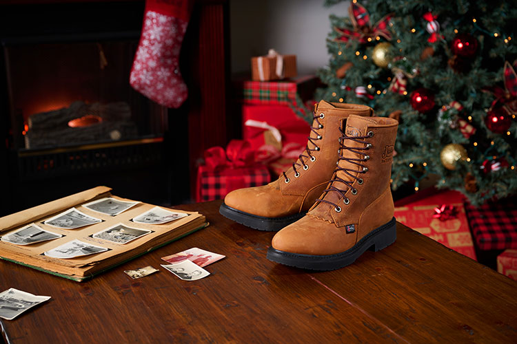 Livestock 8" Waterproof in aged bark brown posed on a wooden table with a Christmas scene behind it.